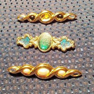 Three Brooches